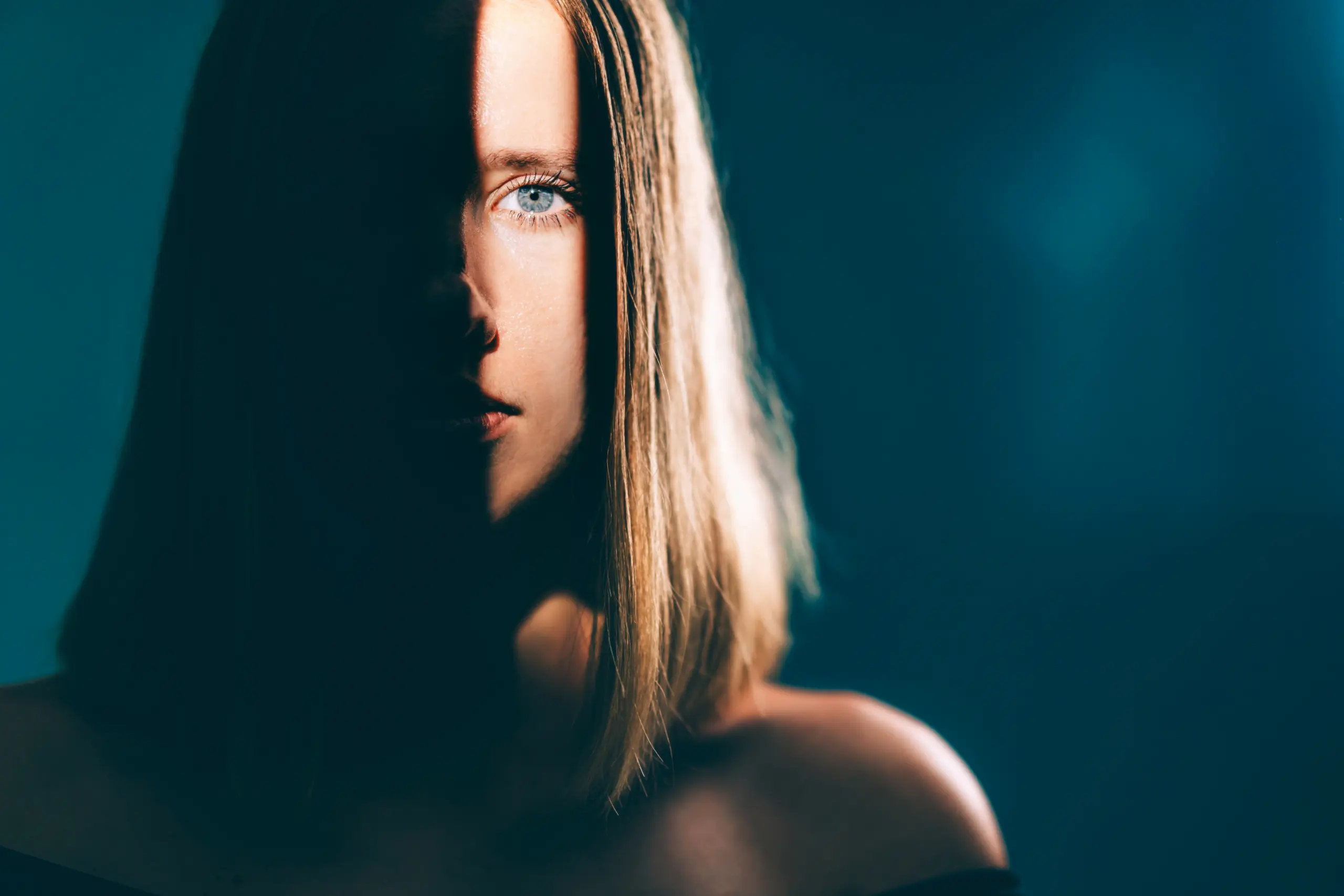 Women with half a shadow on her face.